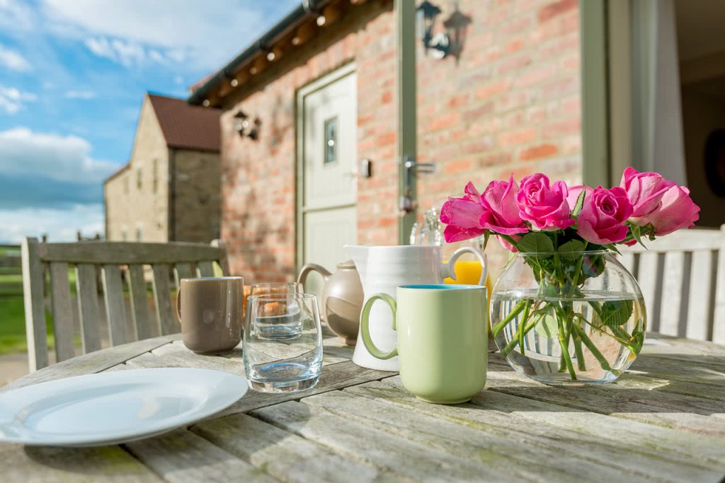 fresh flowers and cup of tea